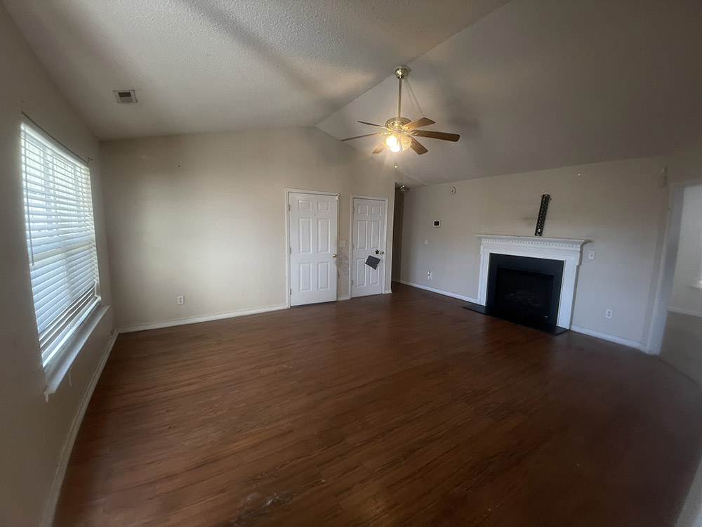 Vaulted living room prior to painting and ceiling spray
